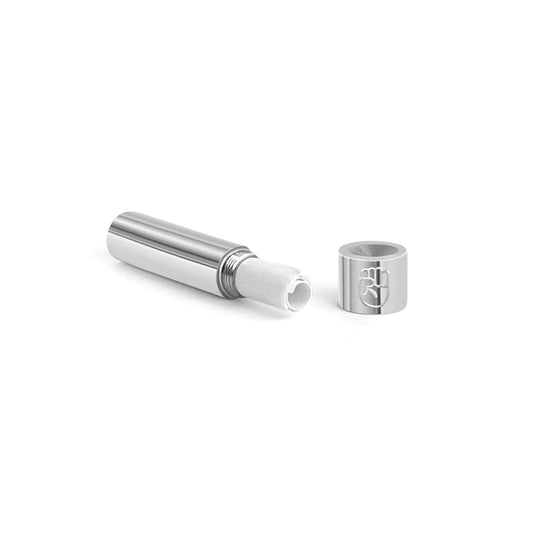 Polished stainless steel screw-top message capsule with an engraved raised fist symbol, shown open with a rolled handwritten note inside, designed for storing personal messages. Displayed on a clean white background.