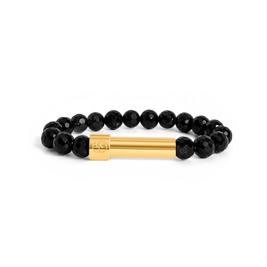 Black facet cut obsidian beaded bracelet with a sleek stainless steel 18k gold plated screw-top message capsule, designed to store handwritten notes, displayed on a white background.